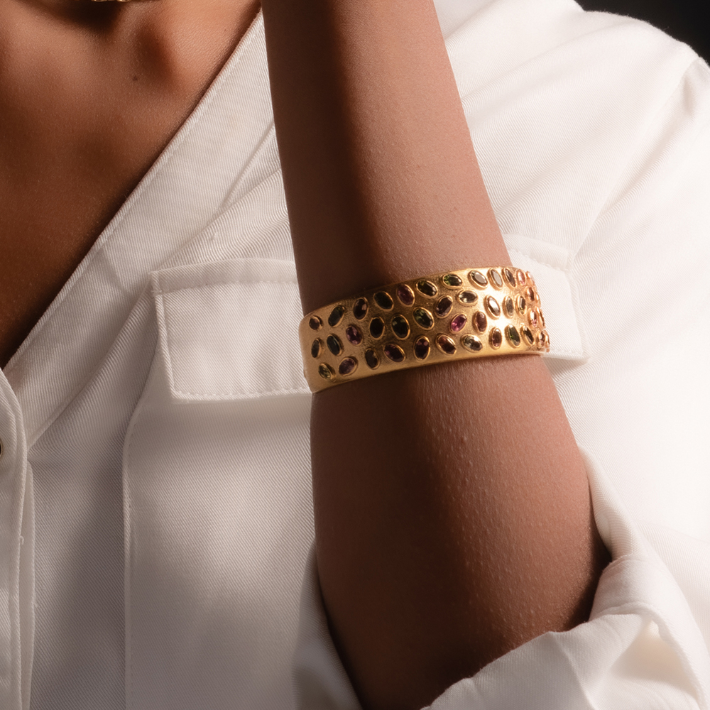 gold bracelet with ruby, emerald and sapphire